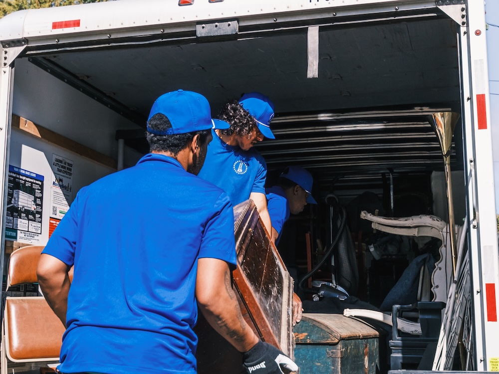 Blue Dolly moving crew loading items
